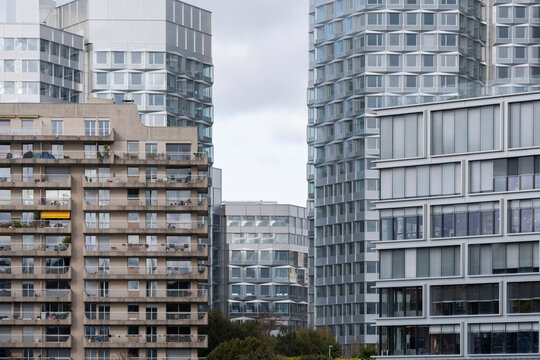 Modern apartment architecture in Paris France featuring residential highrise facade with windows in an urban skyline view showing contemporary city housing