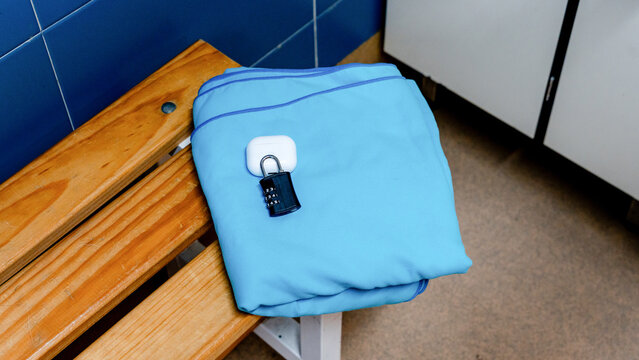 Blue towel with lock in a gym locker room