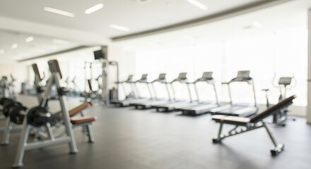 Fototapeta premium Ethereal Gym Scene with Defocused Workout Area Featuring Treadmills, Exercise Bikes, and Weights