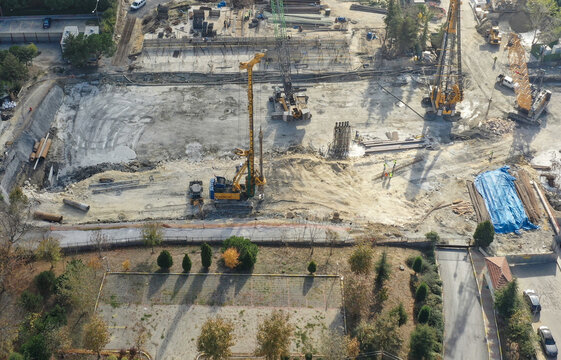 Aerial view of a construction site with heavy machinery, digging, and infrastructure work in progress, Avcilar, Istanbul, Turkey.