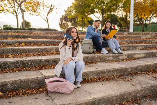 Students enjoying leisure time on stone steps
