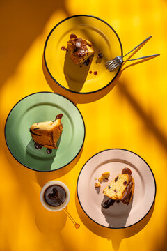 Three sponge cake slices on colorful plates