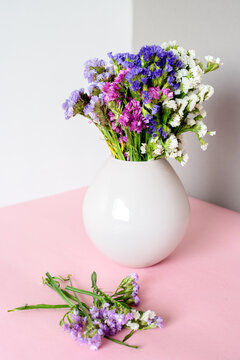 Vibrant bouquet of colorful flowers in white vase