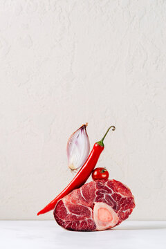 Veal shank with red chili, onion, and tomato display