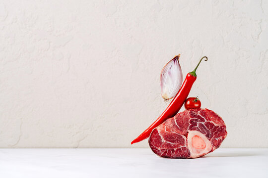 Veal shank with red chili, onion, and tomato display