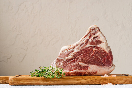 Ribeye steak with fresh thyme and pink salt