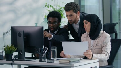 Multicultural business colleagues teamwork in office multiracial three co-workers working together...