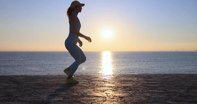 Athlete woman runner got sports injury running at the beach