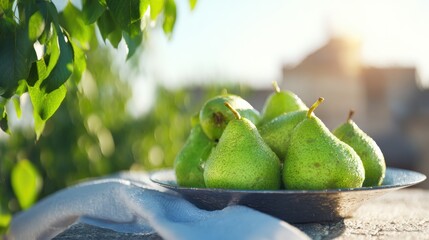 Fresh green pears on a plate under sunlight in a garden setting