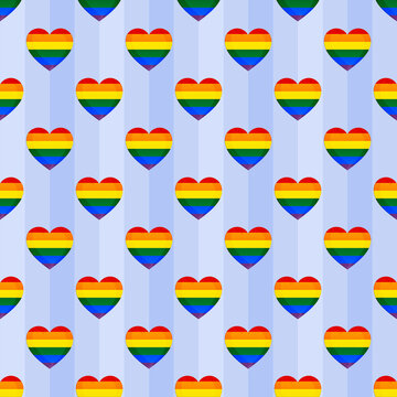 Seamless pride heart pattern with rainbow colors on light blue stripes. LGBTQ+ pride month background for love and equality. Repeating hearts wallpaper for greeting cards and textile design.
