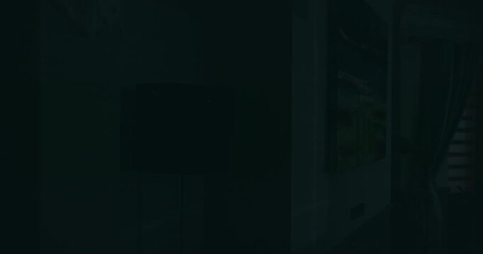 Dim room, light turning off, creating a calm and quiet atmosphere