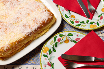 Carrot cake. Glass dish with a cake made with coconut, carrots, and brioche buns.