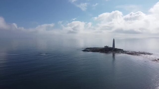 Mid-Range Aerial Hover Viewing Lighthouse and Causeway