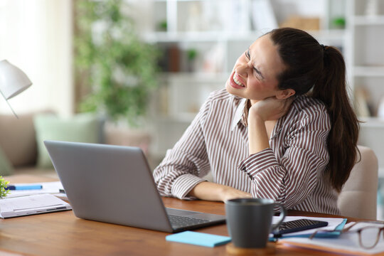 Freelancer suffering neck ache while working at home