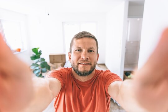 Man reaching forward in new home during moving and relocation