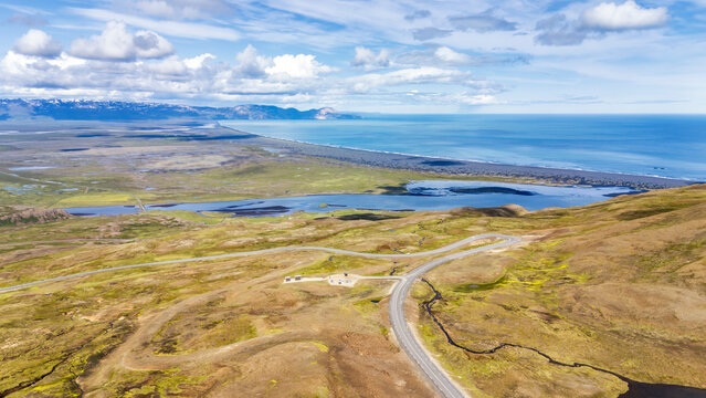 Aerial drone view of winding Route 94, mountain pass and H�ra�ssandur beach in Iceland
