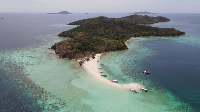 Aerial view of boats dotting the beach against the turquoise water, a tropical paradise of Coron, Mimaropa, Philippines.
