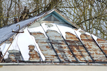 Roof of a traditional house, snow covered