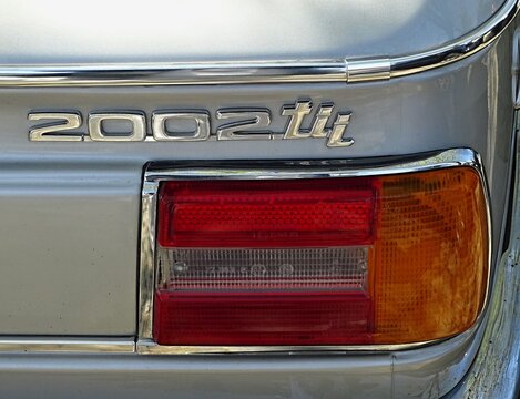 Chrome emblem and taillight on vintage BMW 2002 tii