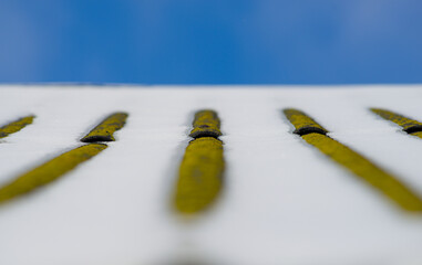 Roof covered by snow and blue sky