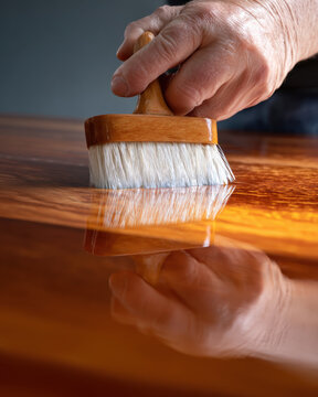 Applying varnish to wood surface