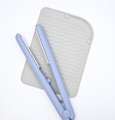 Hair Straightener with Heat Resistant Mat on White