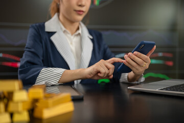 Fototapeta premium Businesswoman trading stocks online. Stock brokers looking at graphs.