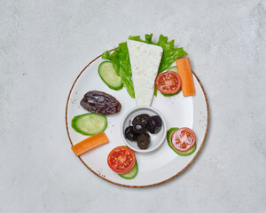 Abundant Ramadan table with mixed grill, lentil soup, fresh salads, and traditional Turkish dishes served elegantly.