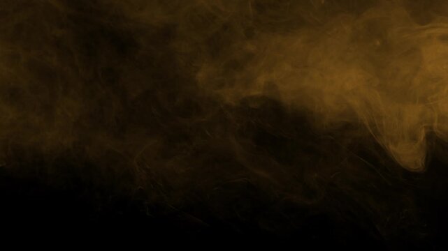 Orange smoke and fog effect element slowly moving. Isolated on black background, ideal for compositing
