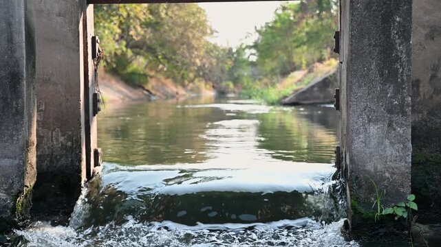 Concrete Floodgate Structure Controlling Water Flow in Irrigation Canal