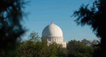 Muslim worship place featuring a white dome and peaceful atmosphere