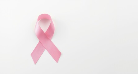 Pink ribbon symbolizing breast cancer awareness featured on a neat white backdrop honoring Women Health Day