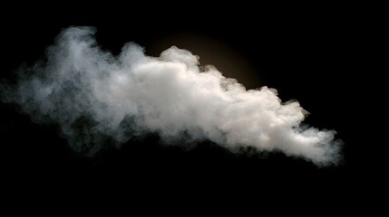 Fototapeta premium A dense plume of white smoke or steam drifts across a dark black background