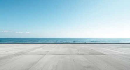 Fototapeta premium Still seaside location featuring an empty concrete area complemented by a wide open sky with copy space