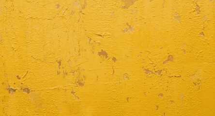 Naklejka premium yellow wall surface closeup displaying textured peeling paint and hints of brown amber colors