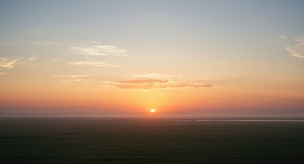 Obraz premium Serene sunrise scene with light cirrus clouds and open copy space for text
