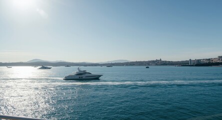 Obraz premium Seaside view with yachts traveling through calm waters and sunshine
