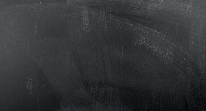 Dark blackboard surface with chalk texture providing perfect copy space for education