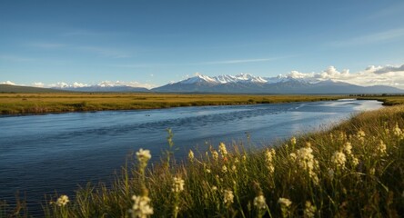 A scenic artwork capturing a wide river cutting through verdant grasslands with a mountain ridge beyond