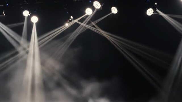 Dramatic stage lighting with spotlights and fog abstract background