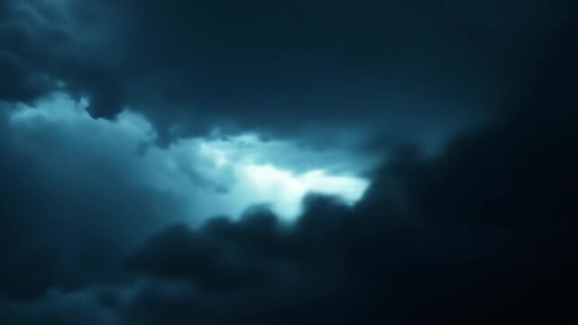 Dramatic storm clouds with lightning strike across a dark sky