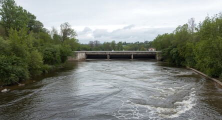 Fototapeta premium Wastewater treatment plant outflow mixing with river current