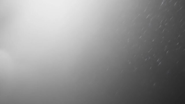 Dramatic monochrome cloudscape with soft textures and ample copy space