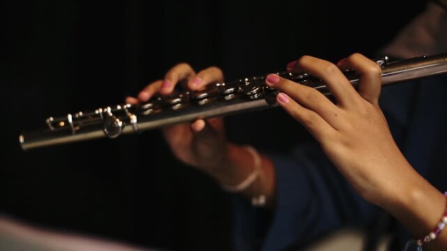 Close-Up of Musician Playing Flute in Studio