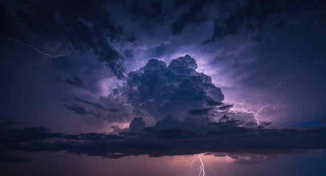 Heavy storm activity captured with bright lightning illuminating clouds