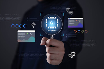 Fototapeta premium Business professional holding magnifying glass AI agents concept with digital interface, data analytics, automation, artificial intelligence technology for enterprise, innovation, and smart workflow.