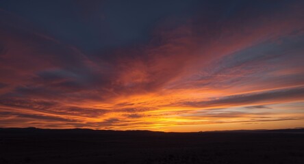 Obraz premium Sunset transforms the sky into a breathtaking color spectacle