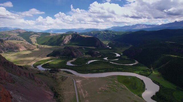 Beautiful aerial landscape winding river meander in mountains with forest trees, Altai Russia, top view.