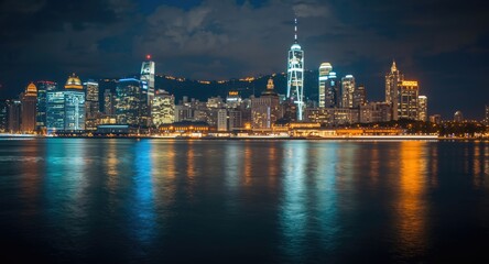 Obraz premium a harmonious night cityscape with sparkling illumination near the waterfront