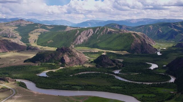 Beautiful aerial landscape winding river meander in mountains with forest trees, Altai Russia, top view.